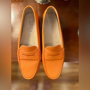 Tod’s brand new, slightly worn ,in box,orange loafers
